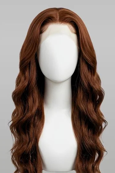 Brown wig on a mannequin head against a gray background