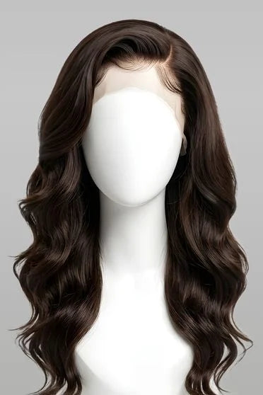 Brown wavy wig on a mannequin head against a gray background