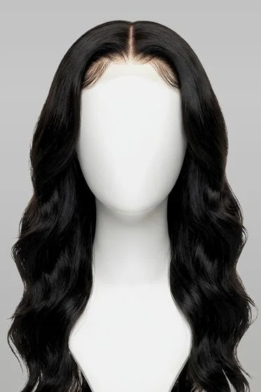 Black wavy wig on a mannequin head against a gray background